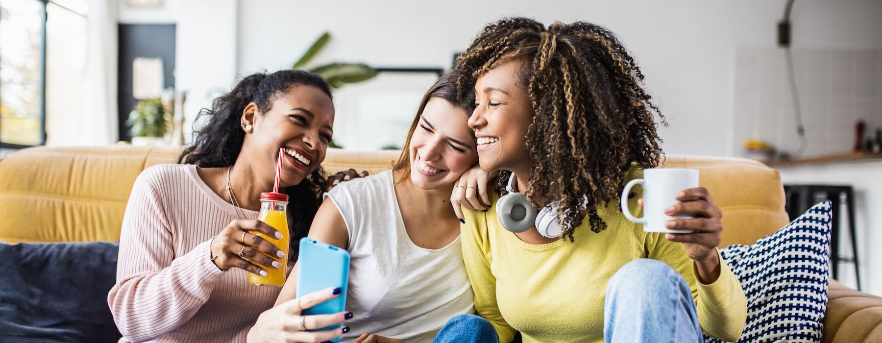 a group of women sitting on a couch