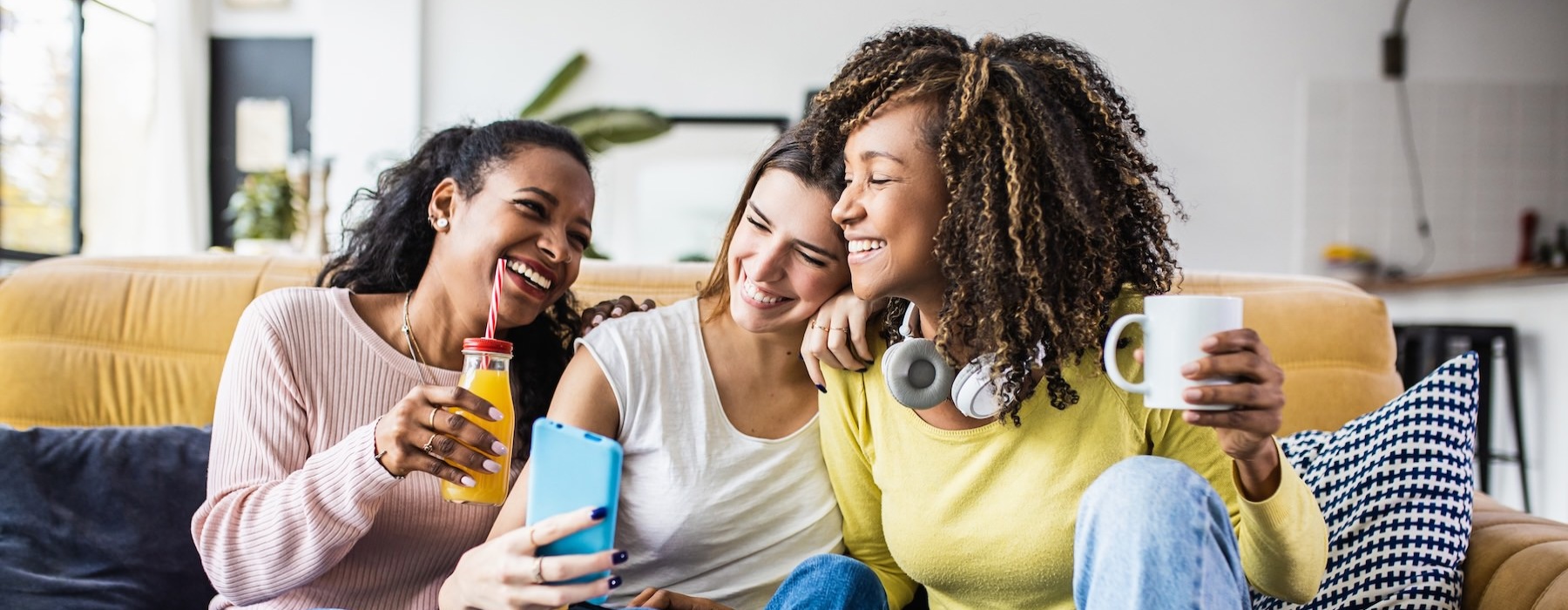 a group of women sitting on a couch