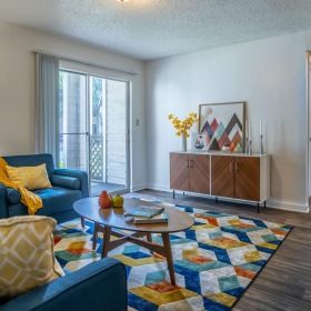 a living room with blue couches