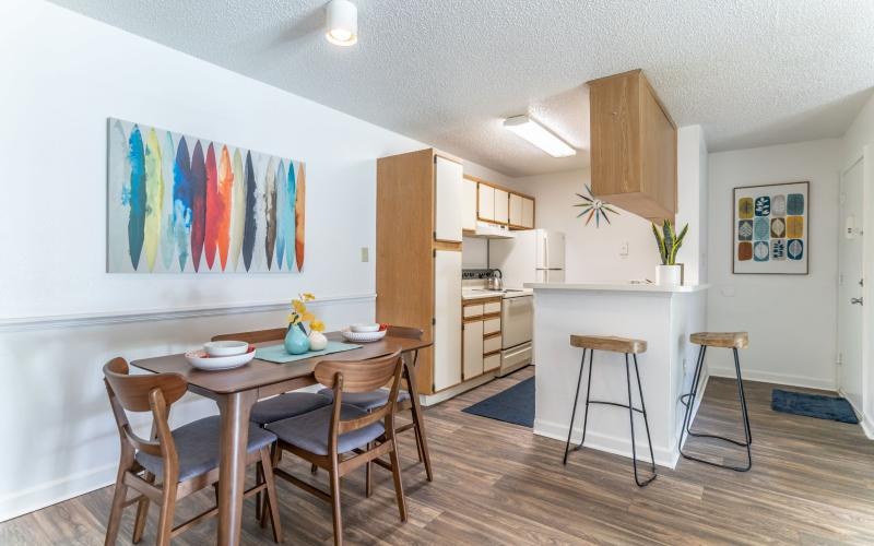 a kitchen with a table and chairs